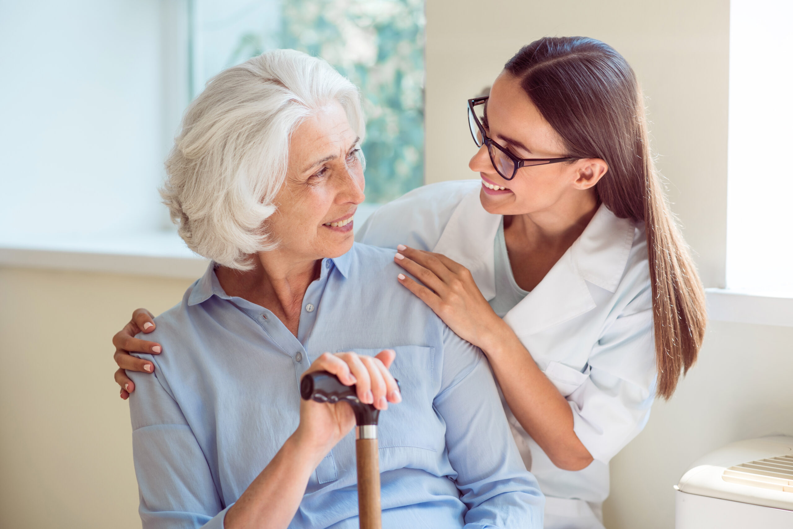 Jasmine Estates of Oklahoma City | Young woman helping senior