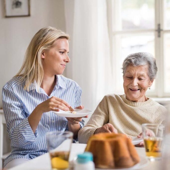Assisted Living Oklahoma City OK | Jasmine Estates OKC | Jasmine Estates of Edmond | Senior woman laughing with caregiver